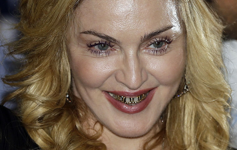 FILE - In a Wednesday, Aug. 21, 2013 file photo, U.S. pop star Madonna smiles during her visit at the "Hard Candy Fitness" center in Rome. Madonna, John Mellencamp and Led Zeppelin’s Jimmy Page and Robert Plant are among the nominees for the 2014 Songwriters Hall of Fame. They're joined by a number of top acts, including Ray Davies, Sade, Cyndi Lauper and Linda Perry.Songwriters Hall gave The Associated Press a list of nominees in advance of the official announcement, set for Thursday, Oct. 9, 2013. The gala takes place June 12 at the New York Marriott Marquis.(AP Photo/Gregorio Borgia, File)