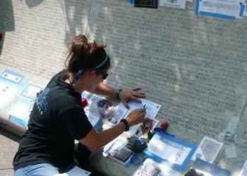 Katie sketching her father's name at the National Law Enforcement Memorial.