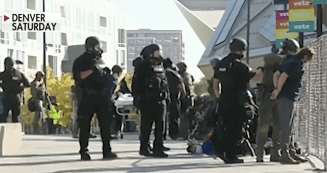 Man shot dead at dueling Denver rallies, suspect in custody