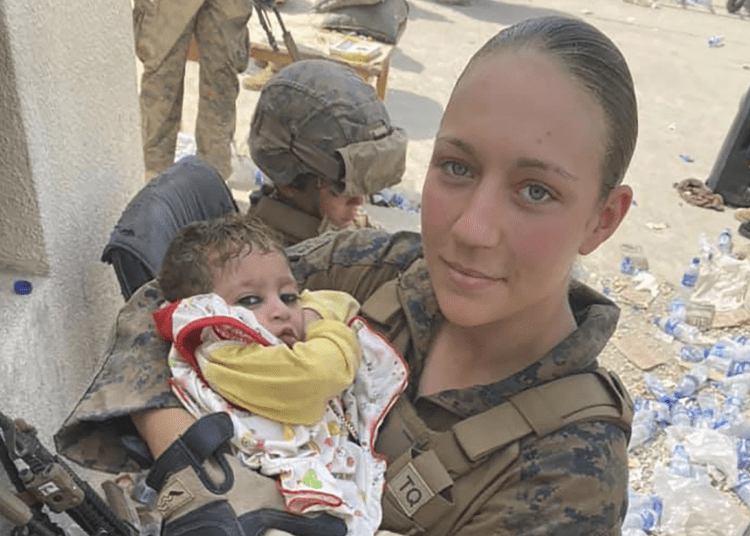 Sergeant Nicole Gee seen cradling Afghan baby last week is ...