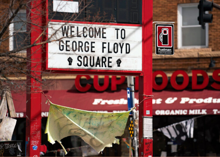 A "Welcome to George Floyd Square" sign at the intersection of East 38th Street and Chicago Avenue in March 2021. (Lorie Shaull/Flickr)