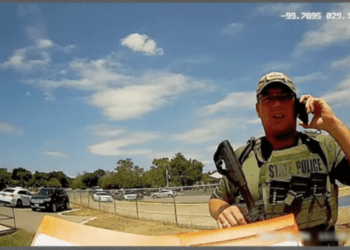 Texas Ranger Christopher Ryan Kindell outside Robb Elementary School in Uvalde on May 24, 2022, when 19 people 17 children and two adults were killed by a gunman. Kindell was fired by DPS Thursday and said he plans to appeal. (Texas Parks And Wildlife Bodycam, Texas Parks And Wildlife Bodycam)