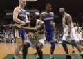 Shawn Kemp in foreground during his playing days. (Screenshot NBA - YouTube)